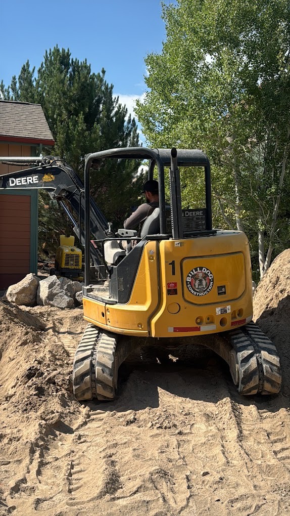 Mini excavator performing precision trenching for utility installation